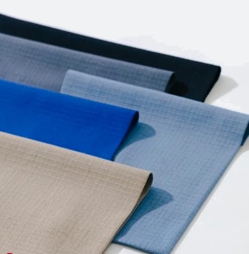 Stacked rolls of technical flame-retardant fabrics